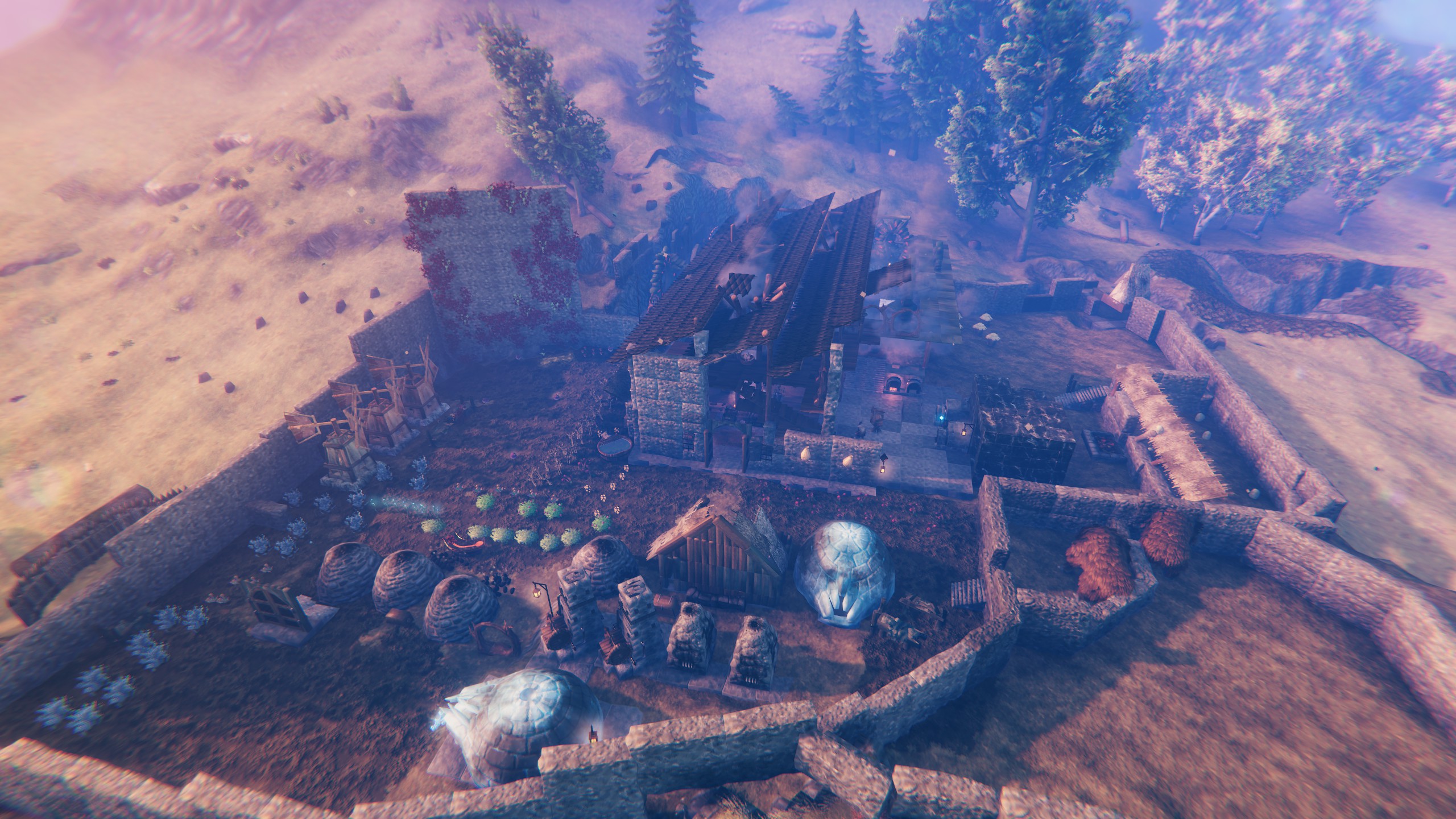 The walled settlement from above: longhouse, garden rows, beehives and trophy dragon eggs.